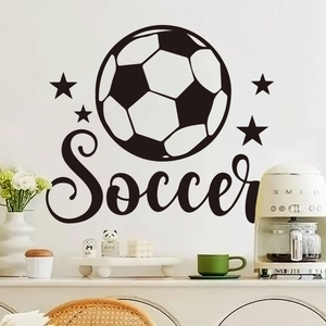 Detailed view of soccer wall sticker with black stars and soccer text on a white wall