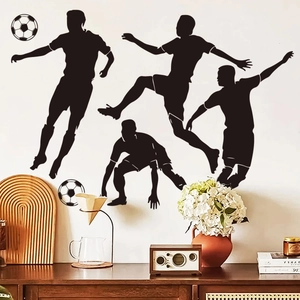 Detail of wall stickers showing black football player silhouettes on a clean white living room wall