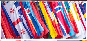 Vertical display of vibrant polyester national flags including Georgia and Greece