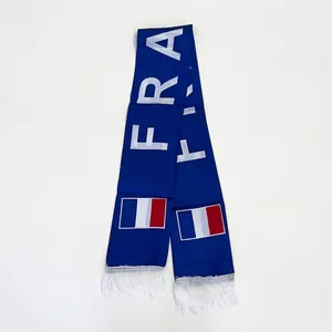 Detail of blue France football fan scarf featuring FRA text and white fringe tassels
