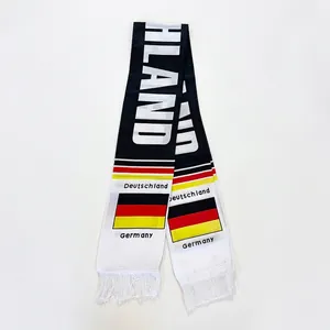 Detail of Germany football fan scarf with Deutschland text and white tassels