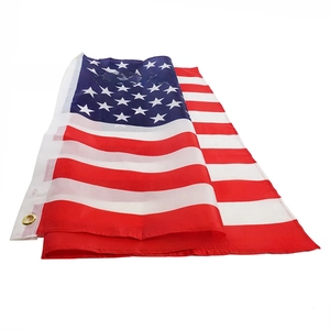 Detail of USA flag with durable metal grommets and reinforced white canvas header