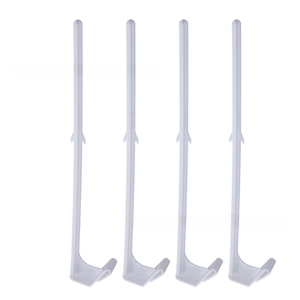 Detailed view of four durable white plastic flag pole attachment hooks with curved base