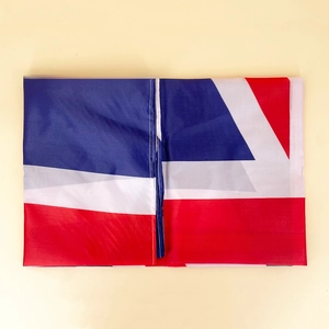 Detail of durable polyester United Kingdom flag with reinforced white stitching and vivid colors