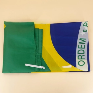 Detail of folded Brazilian flag with polyester fabric texture and white ties