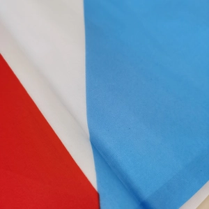 Detailed close-up of the Puerto Rico flag material showing durable polyester weave texture