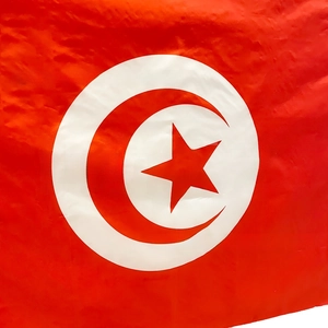 Detailed view of the Tunisia national flag fabric with red crescent and star embroidery