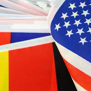 Pile of high-quality polyester world flags including USA and Germany for international events