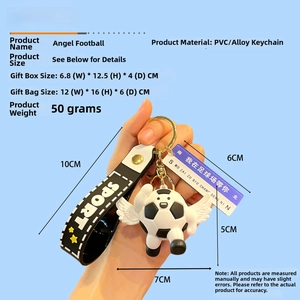Close-up of a winged soccer keychain with SPORT strap in an elegant gift box