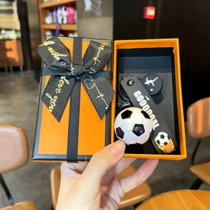 Soccer keychain gift set with Good Goal strap and athlete charm in an orange gift box