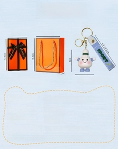 Macro detail of cartoon badminton keychain with sport strap and orange gift packaging