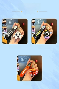 Detail view of sport-themed keychains featuring soccer, pool 8 ball, and basketball designs