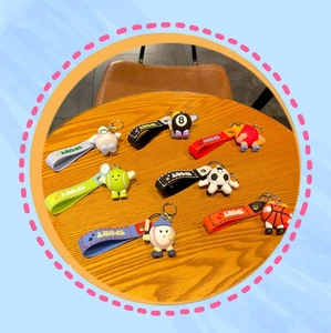 Detailed set of 7 colorful PVC sports ball keychains with matching wrist straps