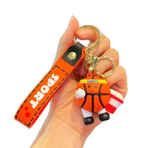 Cartoon basketball keychain with orange sports strap and silicone doll accessory