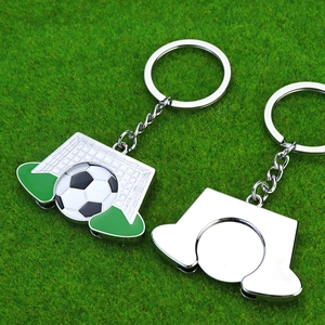 Football trophy keychain for football fans with a green base and silver keyring