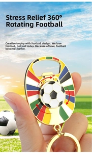 Close-up of golden spinning football keychain with integrated bottle opener feature