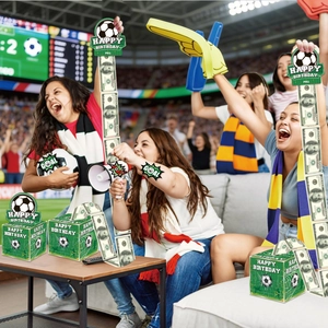 Close-up of World Cup soccer themed birthday money pull box with green football patterns