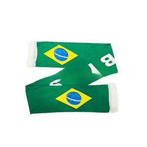 Detailed view of Brazil soccer scarf with green knit fabric, flag and white tassels