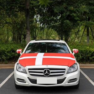 Front view of stretchable red car hood flag and mirror covers with white cross design