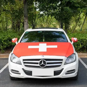 Car hood cover and side mirror covers with Swiss flag design on a white sedan