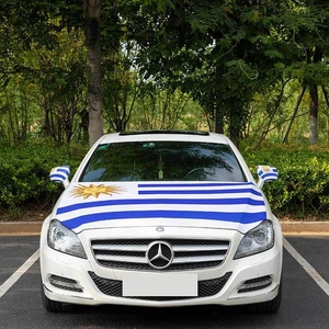 Uruguay flag car hood decal and mirror cover set shown on a white sedan front view