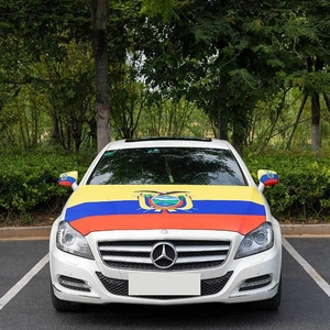 Detail of Ecuador flag car hood cover and rearview mirror protectors on a white car