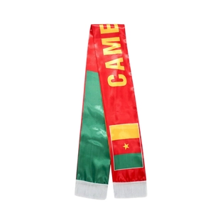Detail of Cameroon fan scarf with vibrant red green yellow colors and white tassels
