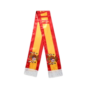 Detail of Spain soccer fan scarf with vibrant stripes, national emblem and white tassels