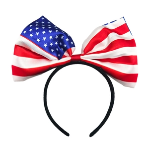 Close-up of a large USA flag pattern satin bow headband for World Cup fan support