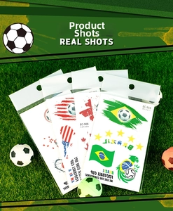 Set of four national flag football tattoo stickers on grass with mini ball decoration