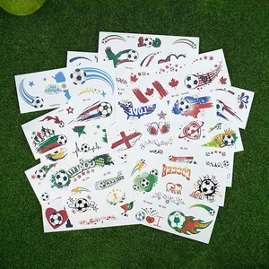 World Cup soccer temporary tattoos with national flags on a green grass background