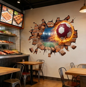 3D football wall sticker showing a flaming soccer ball breaking through a wall on grass