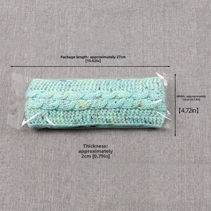 Winter knitted headband in mint green with size dimensions 27cm x 12cm for warm ear protection