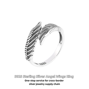 Macro detail of S925 sterling silver angel wing ring with vintage oxidized feather texture