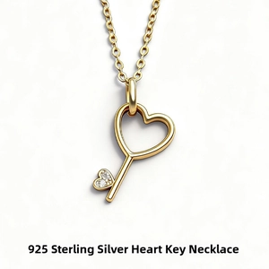 Detailed view of s925 gold-plated heart key pendant necklace with zircon accents