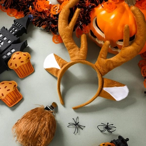 Detail of plush reindeer antler headband and matching tail set for festive costumes