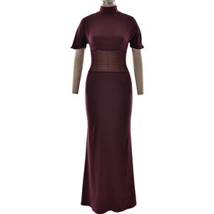 Detail of burgundy evening dress featuring sheer mesh waist patchwork and pleated design