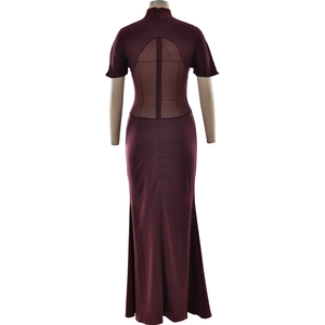 Detail of burgundy fitted maxi dress with semi-transparent mesh patchwork on the back