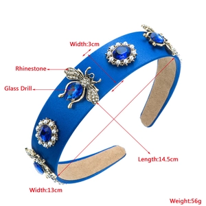 Detailed view of blue satin headband with rhinestone bee and glass gem dimensions