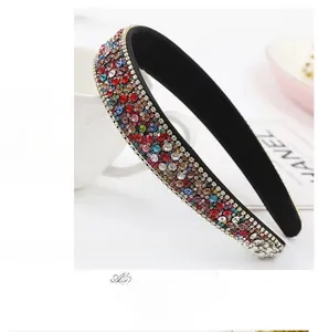 Detailed close-up of rainbow crystal rhinestones on a vintage wide-brimmed headband