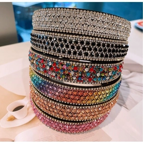 Close-up of six-piece set of sparkling rhinestone headbands in various vibrant colors