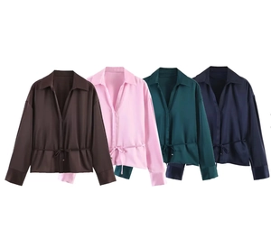 Detail view of four satin long sleeve shirts in chocolate, pink, green, and navy with belts