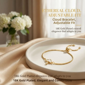 Close-up of 18K gold plated adjustable bracelet with cloud pendant on silk fabric