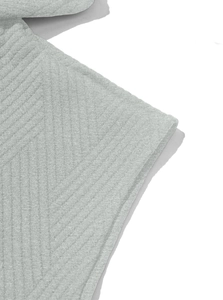 Macro shot of light gray twill knit fabric showing dense texture and soft material