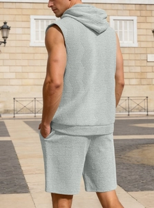 Detailed back view of men's sleeveless knitted hoodie set with grey herringbone pattern