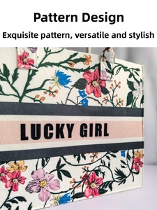 Detail of felt tote bag featuring floral print and Lucky Girl slogan on middle band