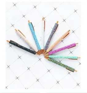 Close-up of 10-piece glitter ballpoint pen set with elegant rose gold accents