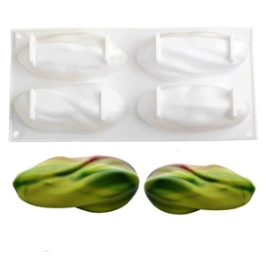 Detail of 4-cavity silicone mold with spiral design and finished banana mousse desserts