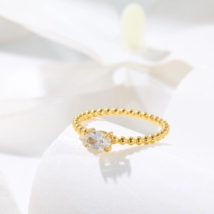Elegant 18K gold plated beaded ring featuring a marquise-cut zircon center stone