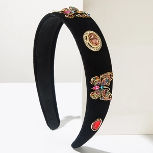 Close-up of velvet headband featuring colorful crystal butterflies and gemstones decoration